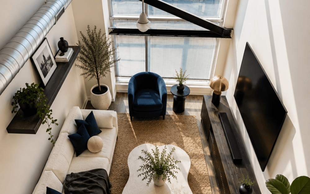 225 North Calvert loft-style apartment in downtown Baltimore featuring a two-story layout, soaring ceilings, and modern industrial design
