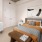 Spacious and well lit bedroom with plush carpet and large windows