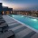 Spacious sparkling pool located on the rooftop with a view of the city 