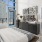 Spacious and well lit bedroom with plush carpet and large windows