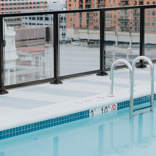 Spacious sparkling pool located on the rooftop with a view of the city 