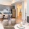 Spacious and well lit kitchen with wood floors and stainless steel appliances. 